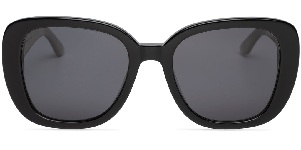 Black sunglasses with dark lenses on a white background