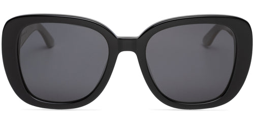 Black sunglasses with dark lenses on a white background