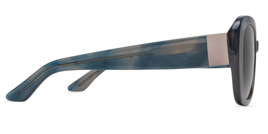 Sunglasses with a blue tortoise frame on a white background, side view