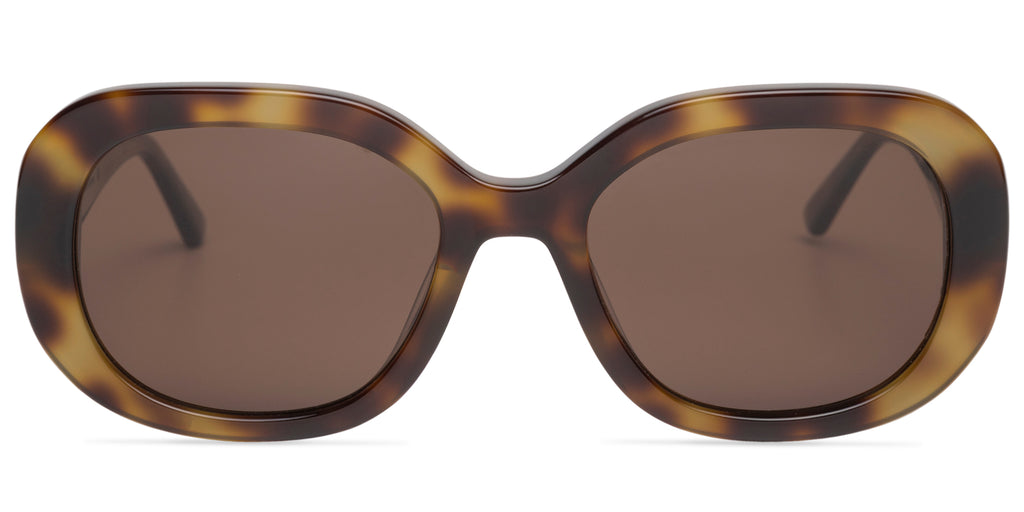 Sunglasses with tortoiseshell frame and dark lenses on a white background