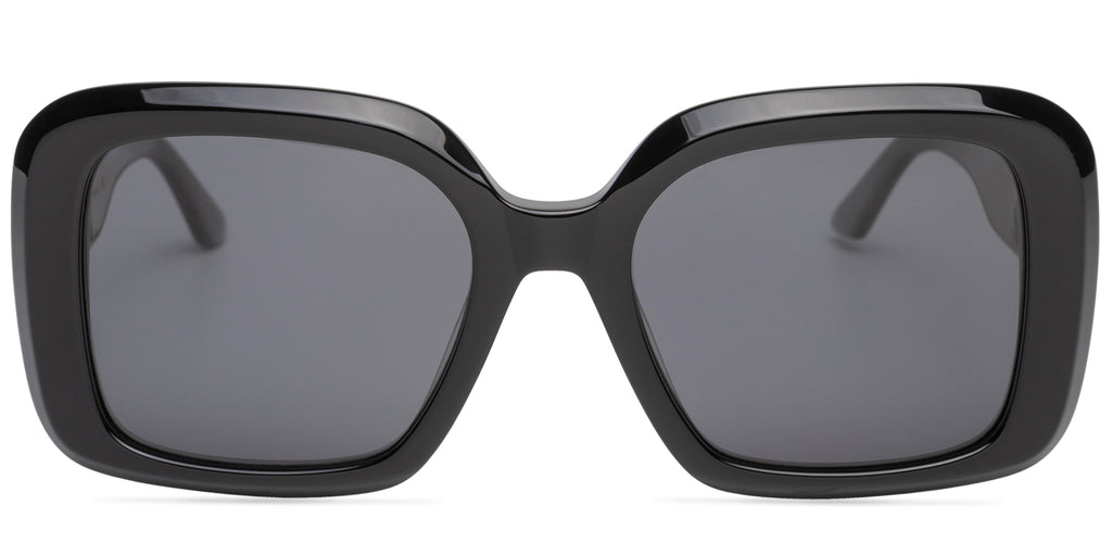 Black sunglasses with dark lenses on a white background