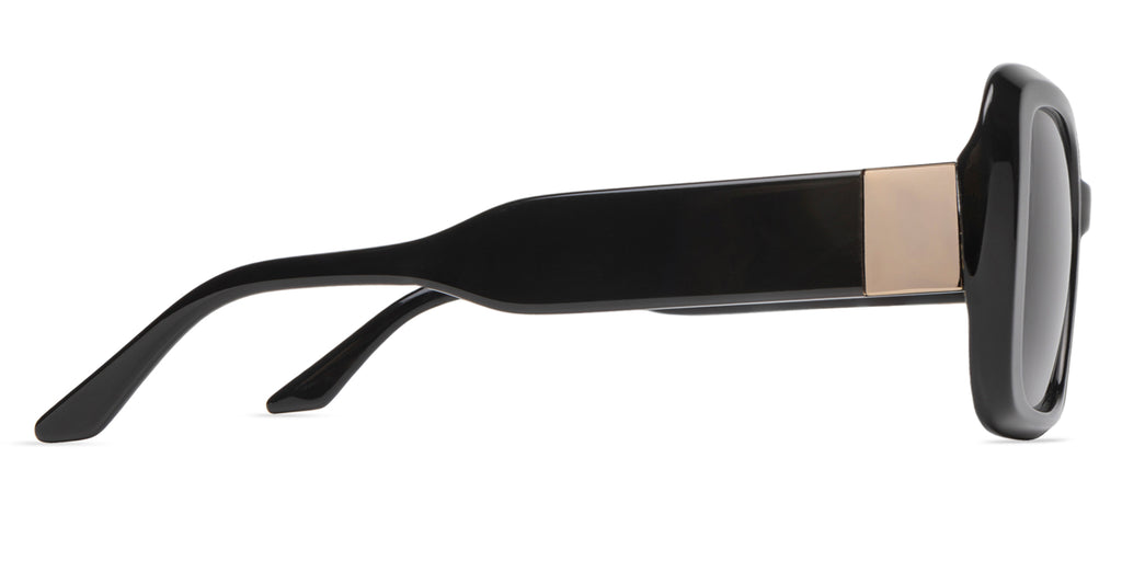 Black sunglasses with a gold accent on a white background side view