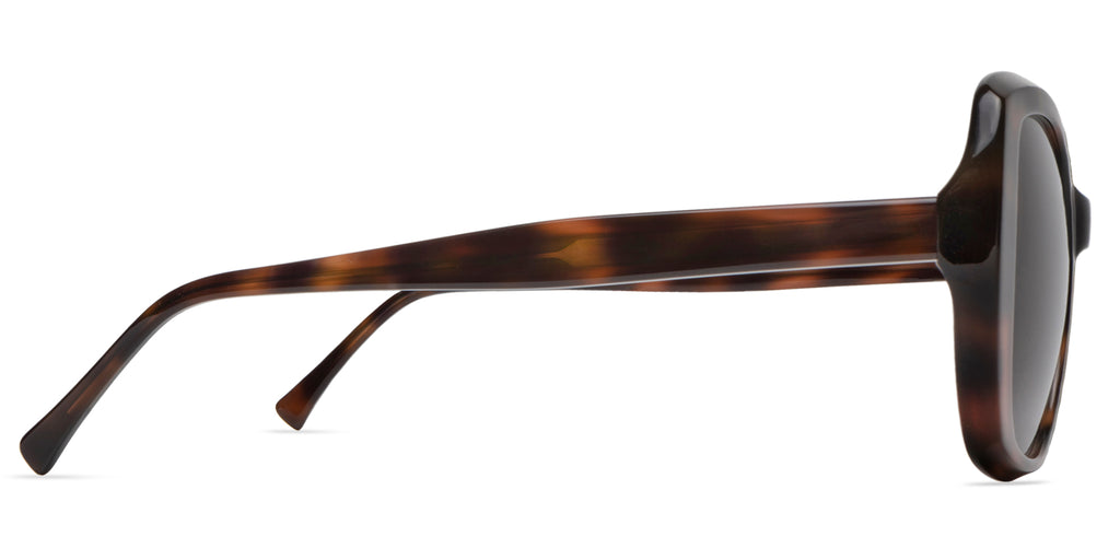 Sunglasses with tortoiseshell frame on a white background side view